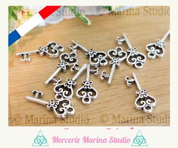 5 breloques clés en argent tibétain 21x9mm